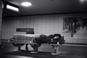Woman sleeping on bench